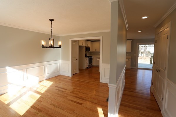 1 Fox Hill Road Ashland, MA 01721 - Photo 6 of 15 a view of a hallway with wooden floor and staircase