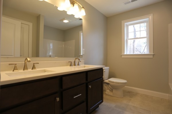 1 Fox Hill Road Ashland, MA 01721 - Photo 8 of 15 a bathroom with a double vanity sink and a mirror