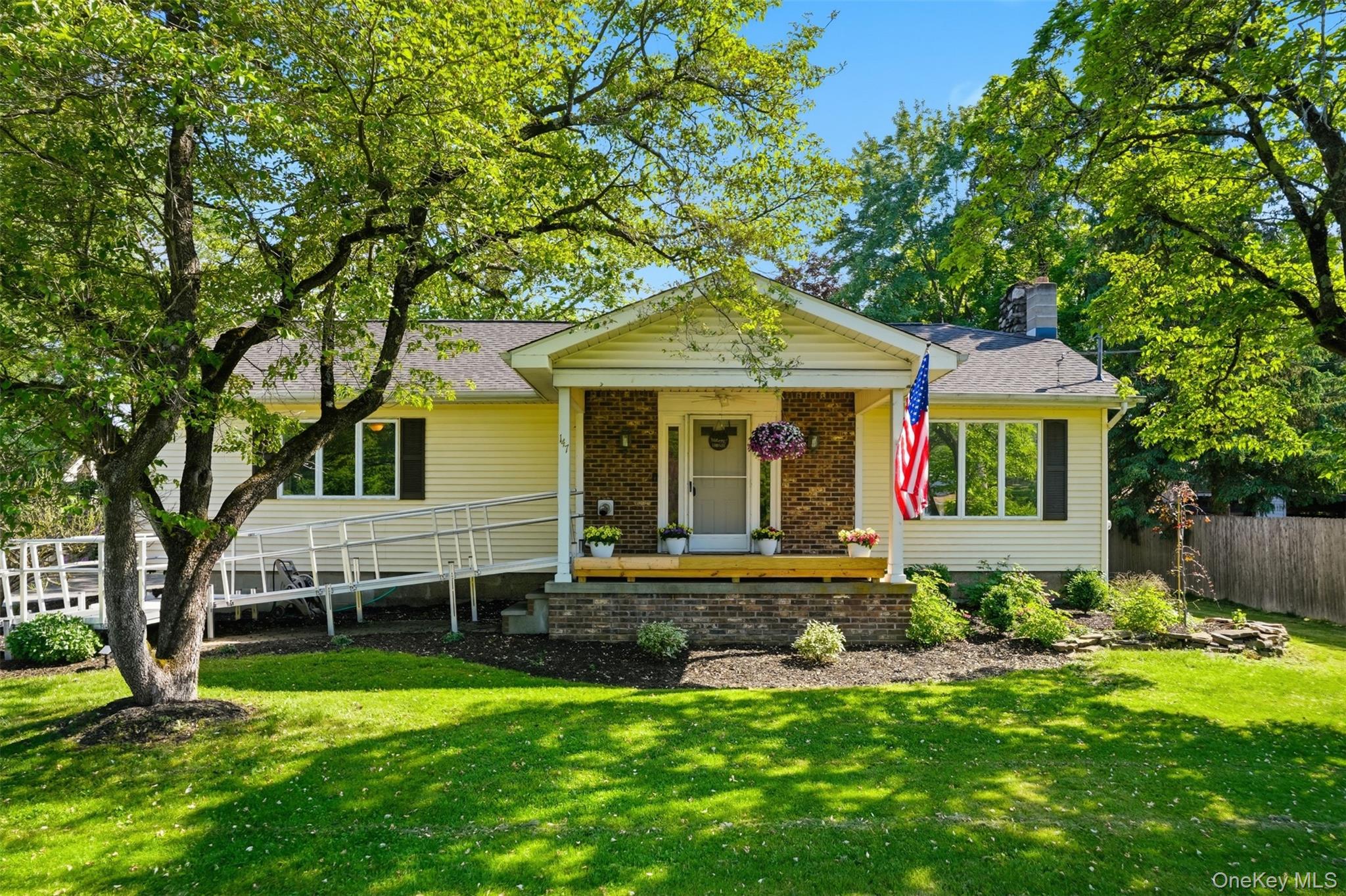 147 County Rte 1 Warwick, NY 10990 - Photo 1 of 45 a front view of a house with a garden and porch