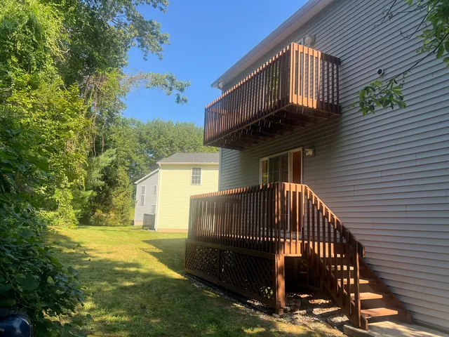a view of a back yard of the house