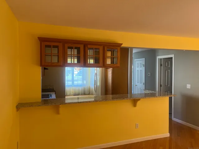 a front view of a house with many windows