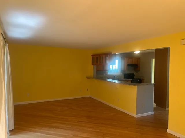 a view of a livingroom with wooden floor
