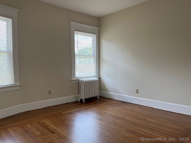 1946 Chapel Street New Haven, CT 06515 - Photo 14 of 18 an empty room with wooden floor and windows