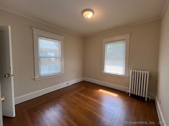 1946 Chapel Street New Haven, CT 06515 - Photo 16 of 18 an empty room with wooden floor and windows