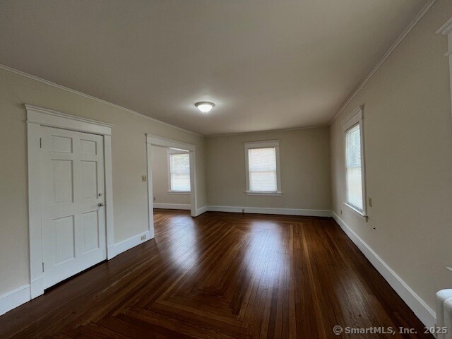 1946 Chapel Street New Haven, CT 06515 - Photo 3 of 18 an empty room with wooden floor and windows