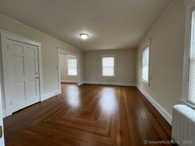 1946 Chapel Street New Haven, CT 06515 - Photo 7 of 18 a view of empty room with window and wooden floor