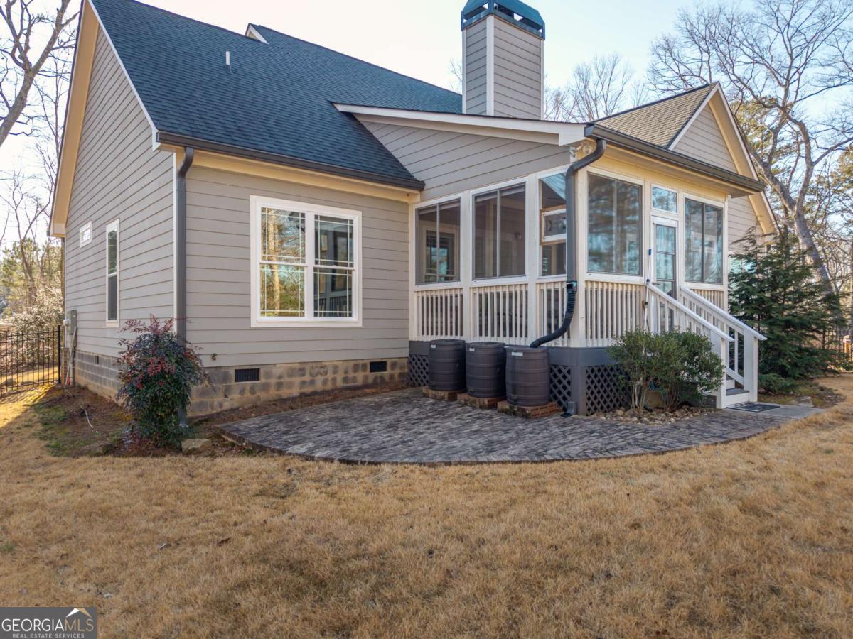 96 Morgan Trail, Unit 15R Ellijay, GA 30536 - Photo 11 of 42 a view of a house with backyard and sitting area