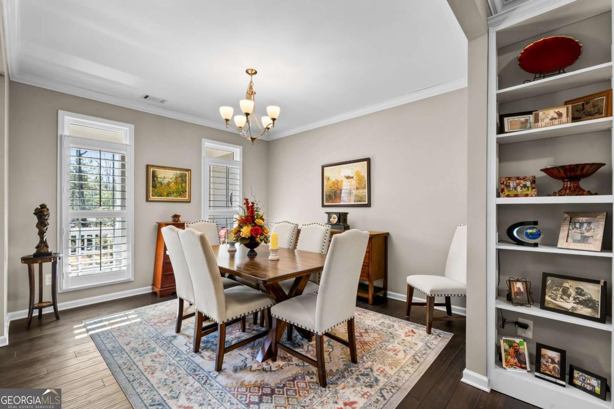 96 Morgan Trail, Unit 15R Ellijay, GA 30536 - Photo 19 of 42 a view of a dining room with furniture and a book shelf