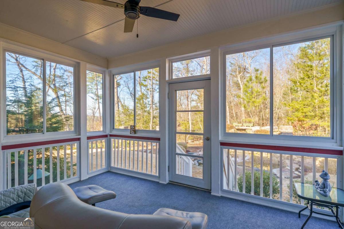 96 Morgan Trail, Unit 15R Ellijay, GA 30536 - Photo 2 of 42 a living room with furniture and a large window