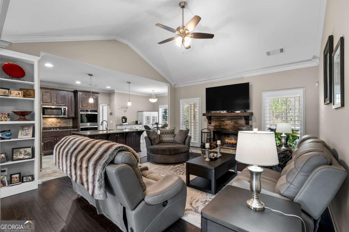 96 Morgan Trail, Unit 15R Ellijay, GA 30536 - Photo 21 of 42 a living room with furniture and a flat screen tv