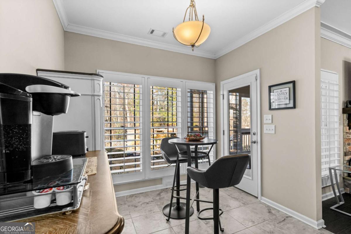 96 Morgan Trail, Unit 15R Ellijay, GA 30536 - Photo 28 of 42 a living room with furniture and a flat screen tv