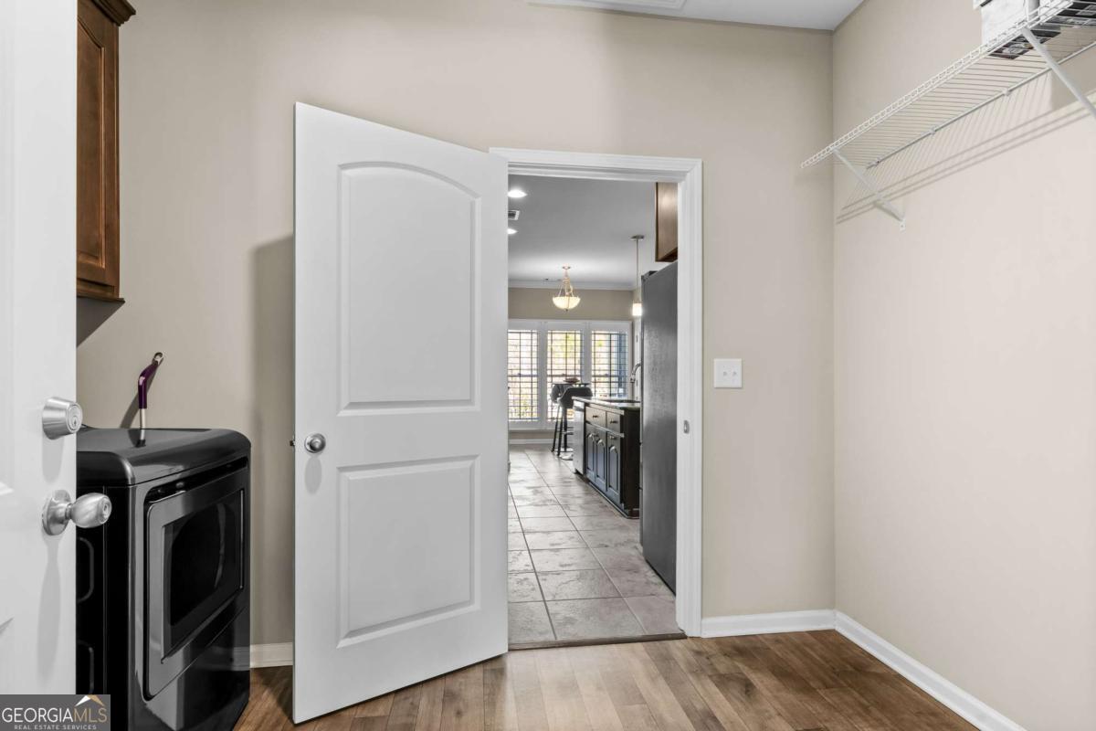 96 Morgan Trail, Unit 15R Ellijay, GA 30536 - Photo 30 of 42 a view of a hallway with a view of living room with wooden floor
