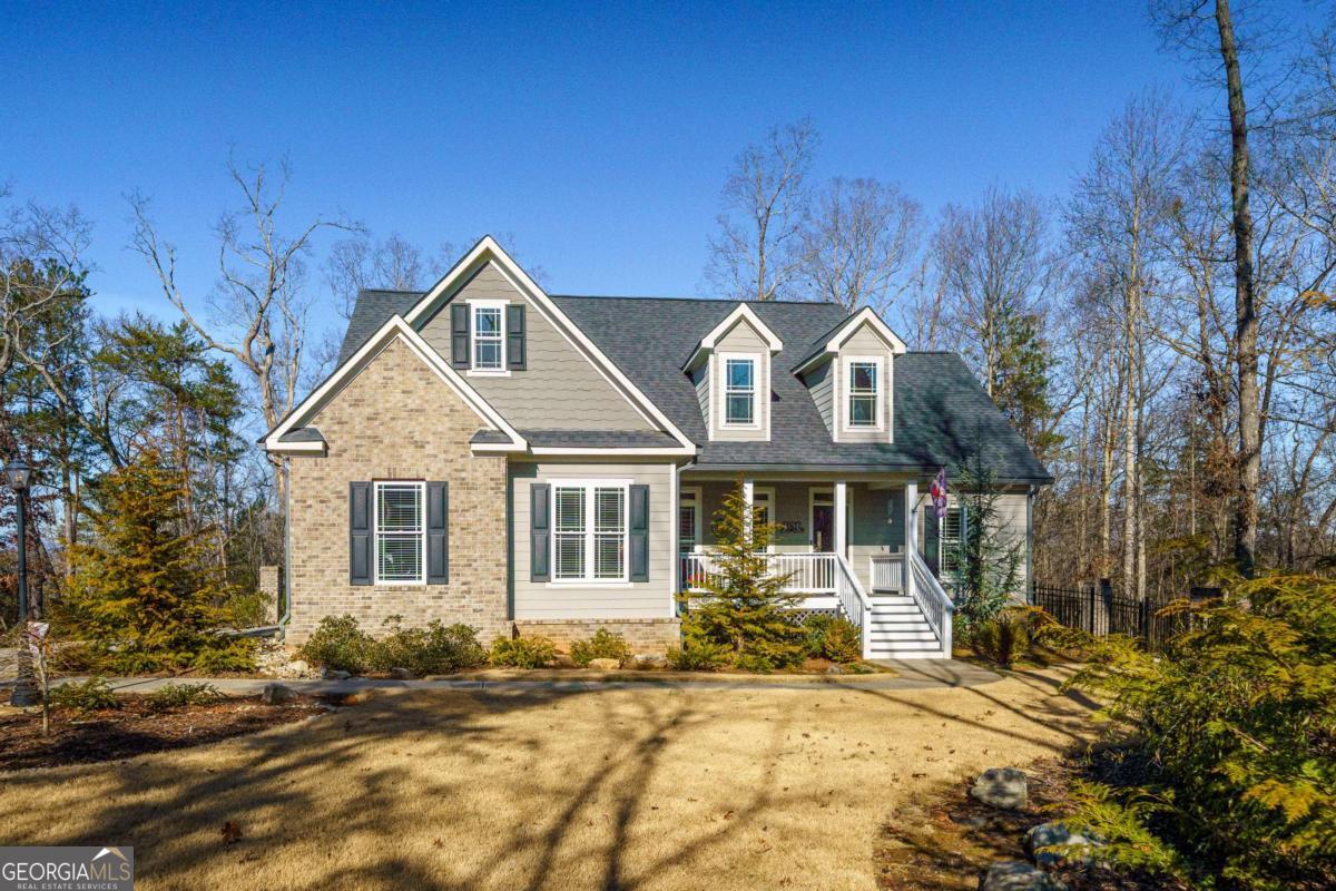 96 Morgan Trail, Unit 15R Ellijay, GA 30536 - Photo 3 of 42 a front view of a house with a yard