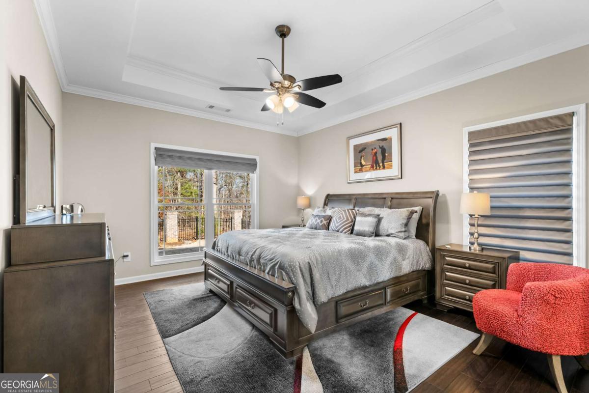 96 Morgan Trail, Unit 15R Ellijay, GA 30536 - Photo 31 of 42 a bedroom with a bed and wooden floor