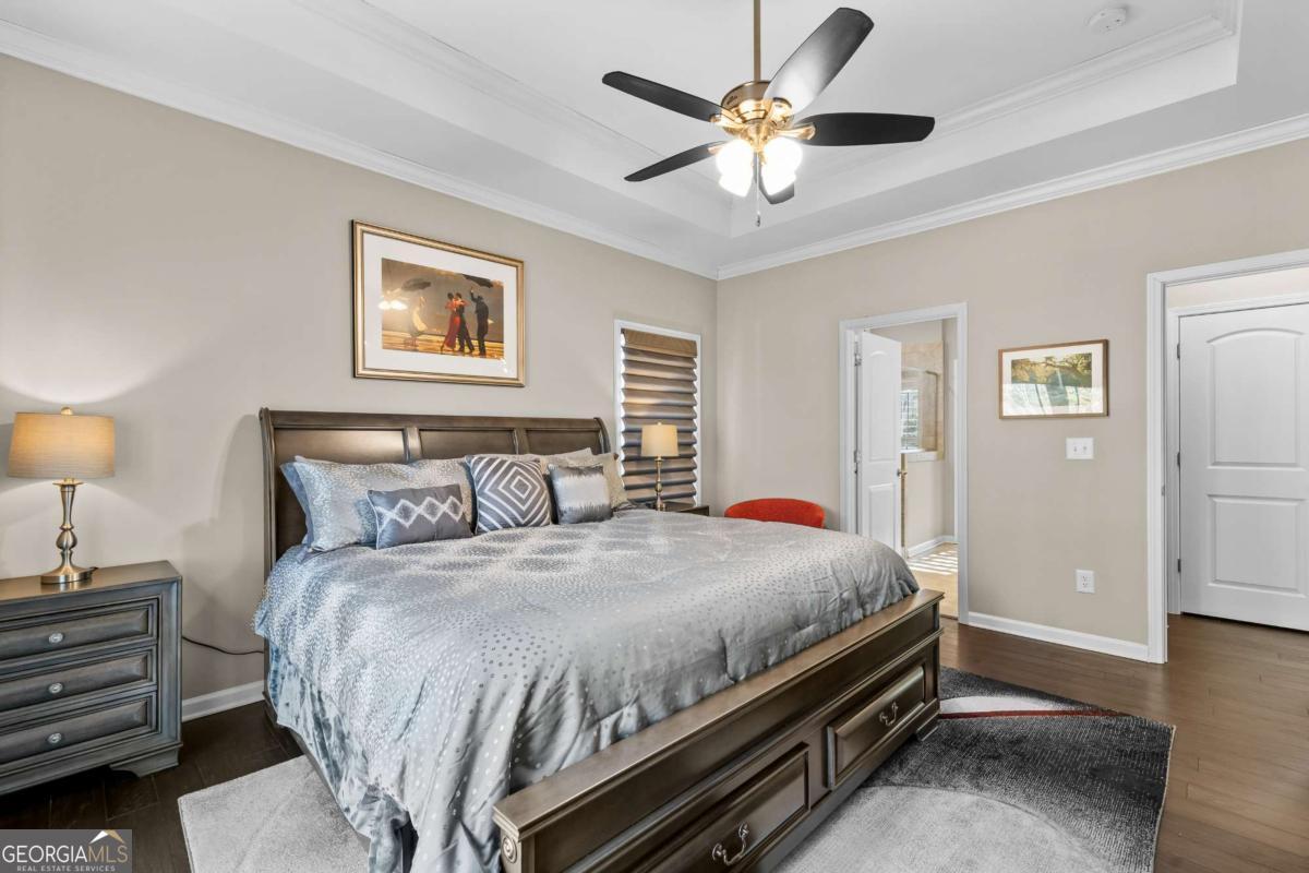 96 Morgan Trail, Unit 15R Ellijay, GA 30536 - Photo 32 of 42 a bedroom with a bed and a chandelier