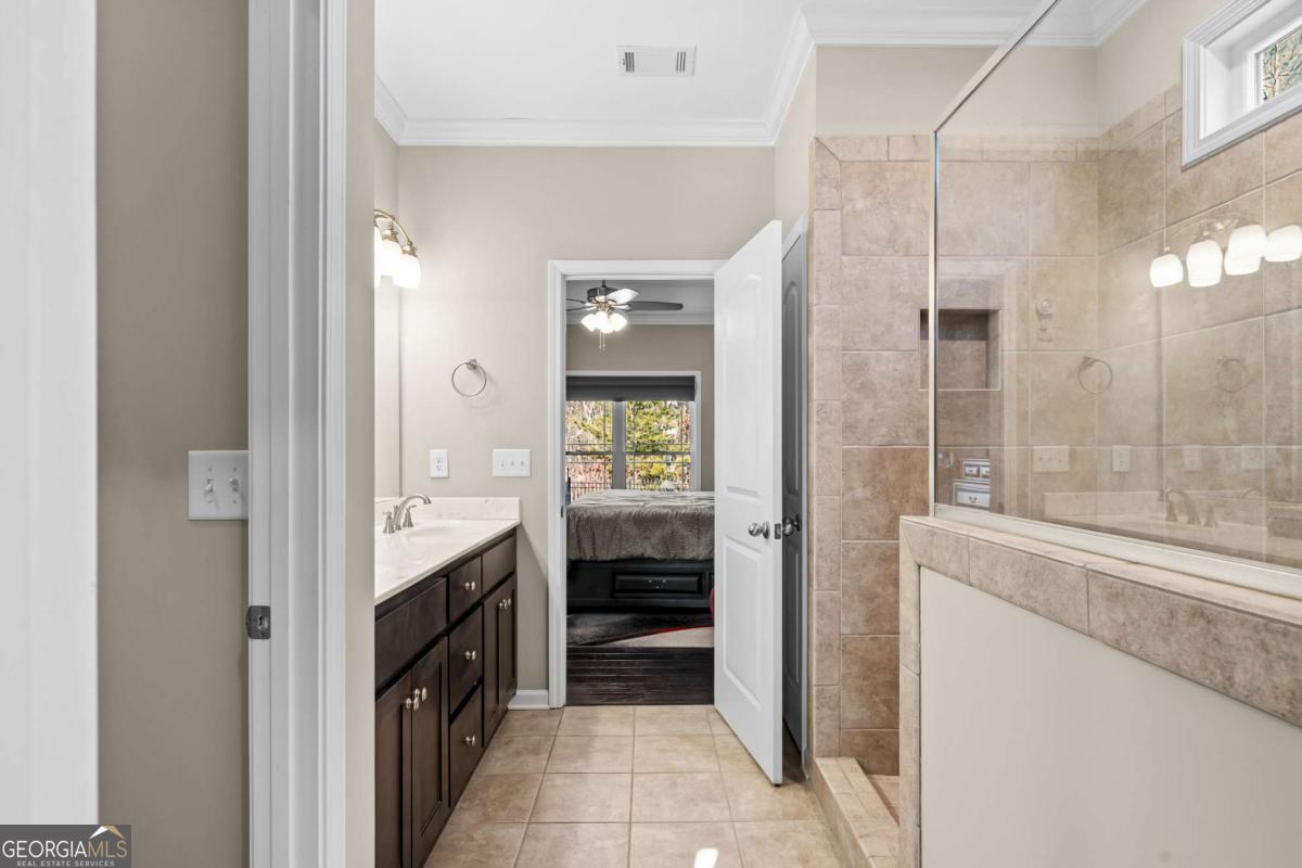 96 Morgan Trail, Unit 15R Ellijay, GA 30536 - Photo 34 of 42 a bathroom with a double vanity sink and a mirror
