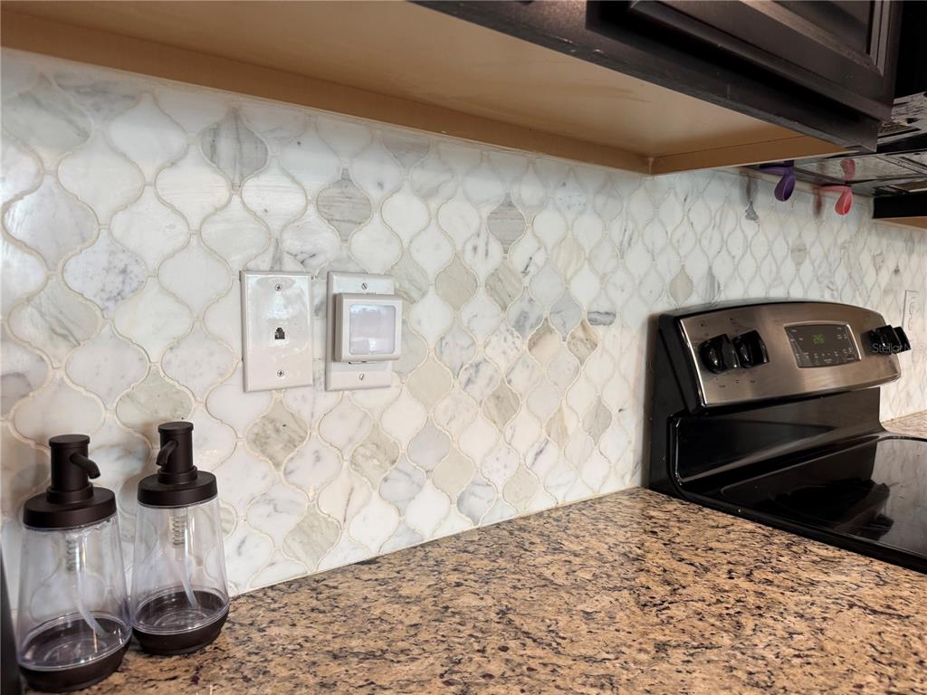 11832 Lake Boulevard New Port Richey, FL 34655 - Photo 15 of 58 a bedroom with a bed and a dresser