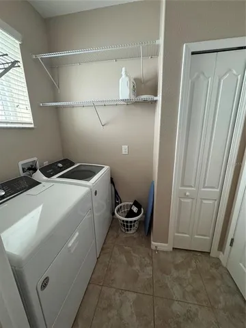 a large bathroom with a large tub and sink