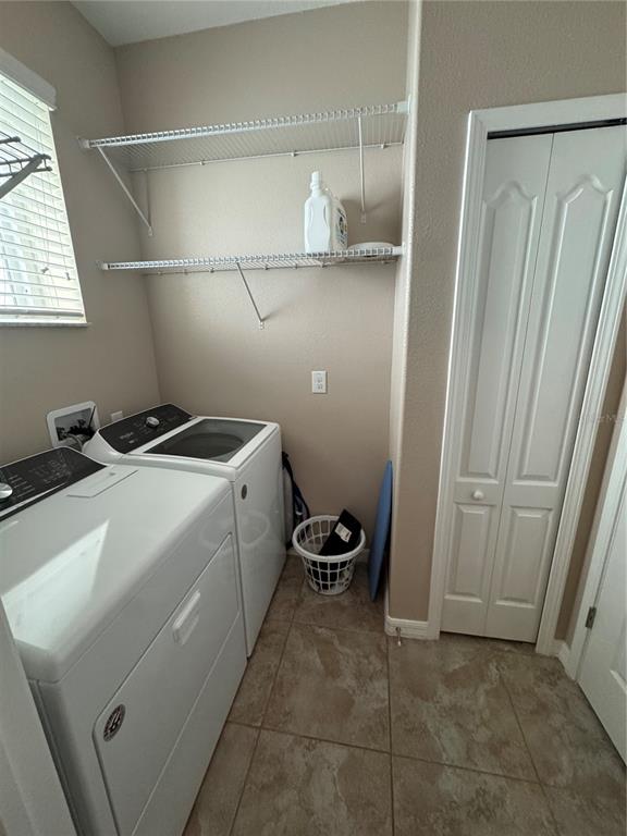 11832 Lake Boulevard New Port Richey, FL 34655 - Photo 18 of 58 a utility room with dryer and washer
