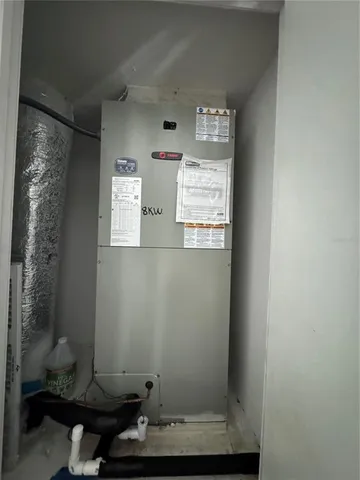 a view of a hallway with wooden floor and entryway