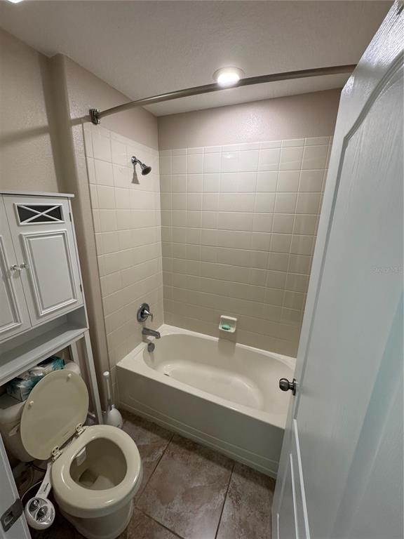 11832 Lake Boulevard New Port Richey, FL 34655 - Photo 31 of 58 a bathroom with a sink a toilet and a mirror