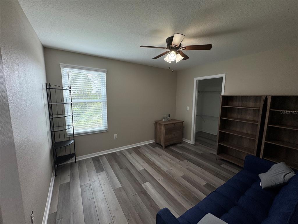 11832 Lake Boulevard New Port Richey, FL 34655 - Photo 38 of 58 wooden floor in an empty room with a window