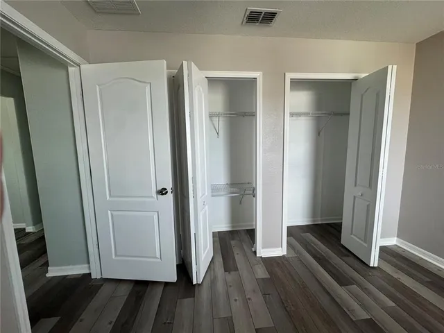 an aerial view of a house with a swimming pool