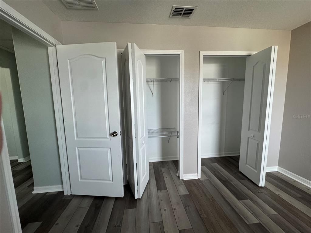 11832 Lake Boulevard New Port Richey, FL 34655 - Photo 44 of 58 a view of a hallway with wooden floor