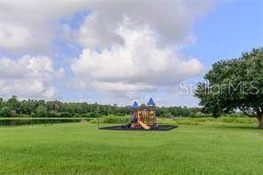 11832 Lake Boulevard New Port Richey, FL 34655 - Photo 58 of 58 a view of a lake and houses in the back