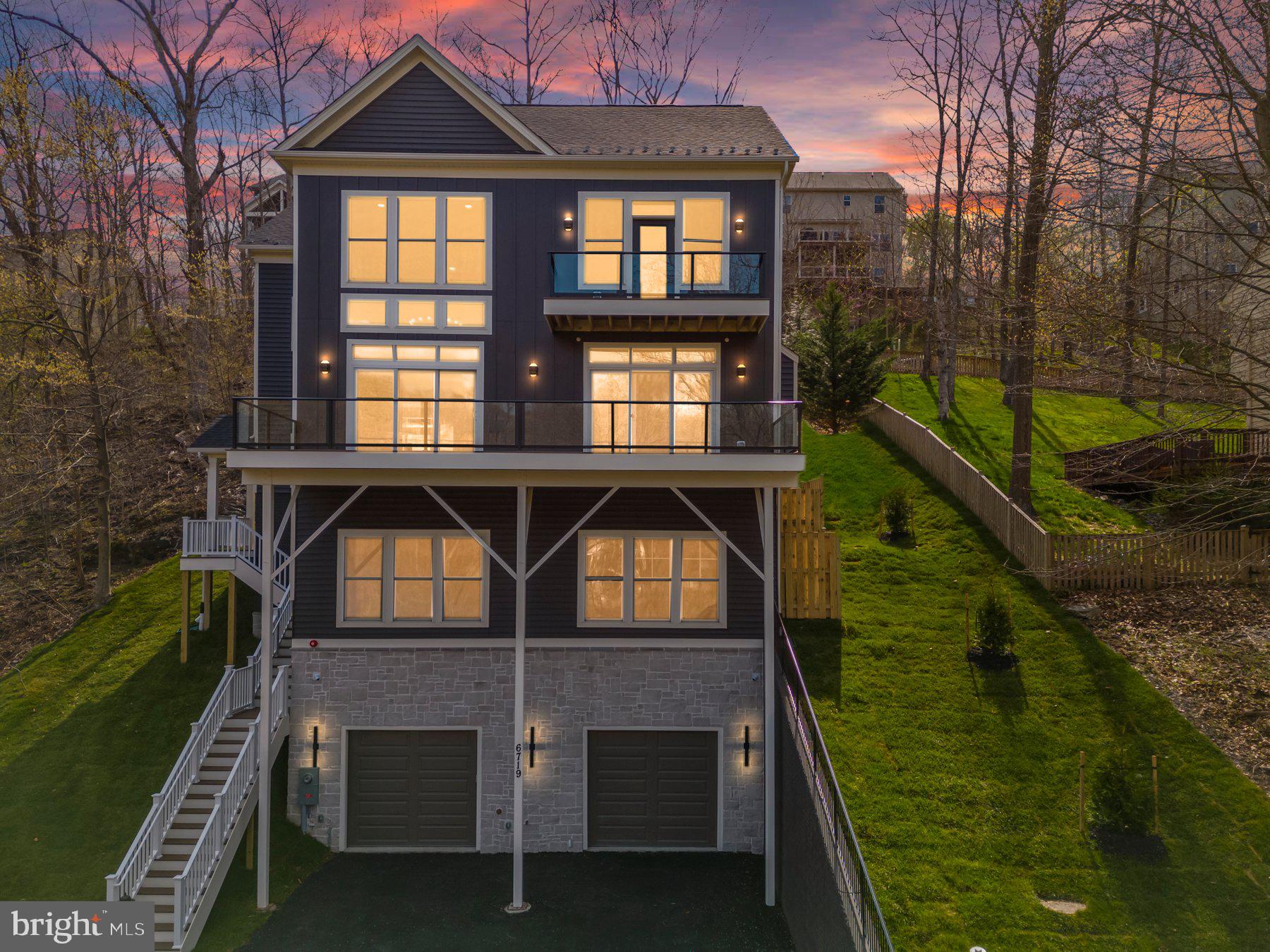 6719 West Lakeridge Road New Market, MD 21774 - Photo 1 of 49 a front view of a house with garden