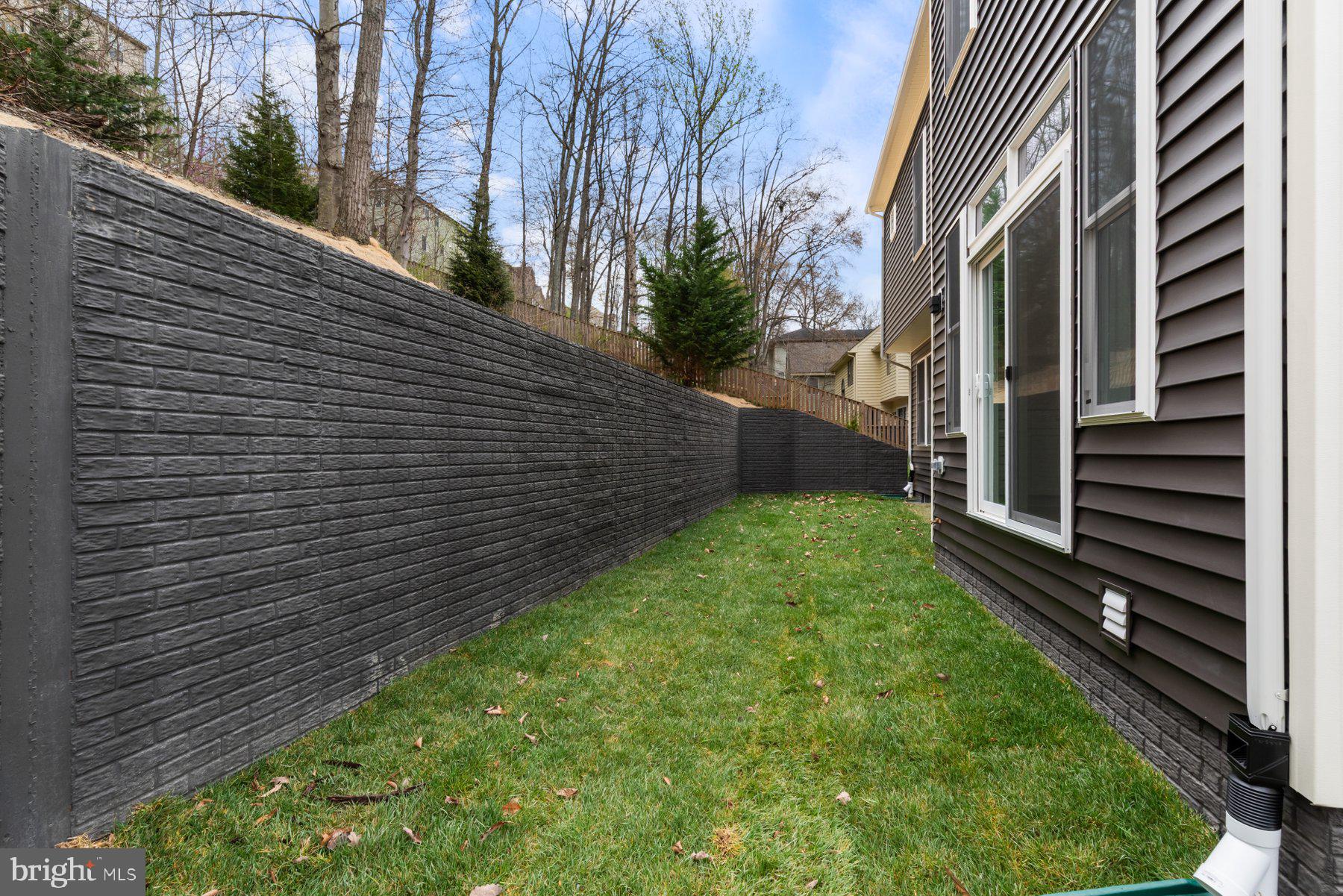 6719 West Lakeridge Road New Market, MD 21774 - Photo 11 of 49 a view of a backyard with pathway