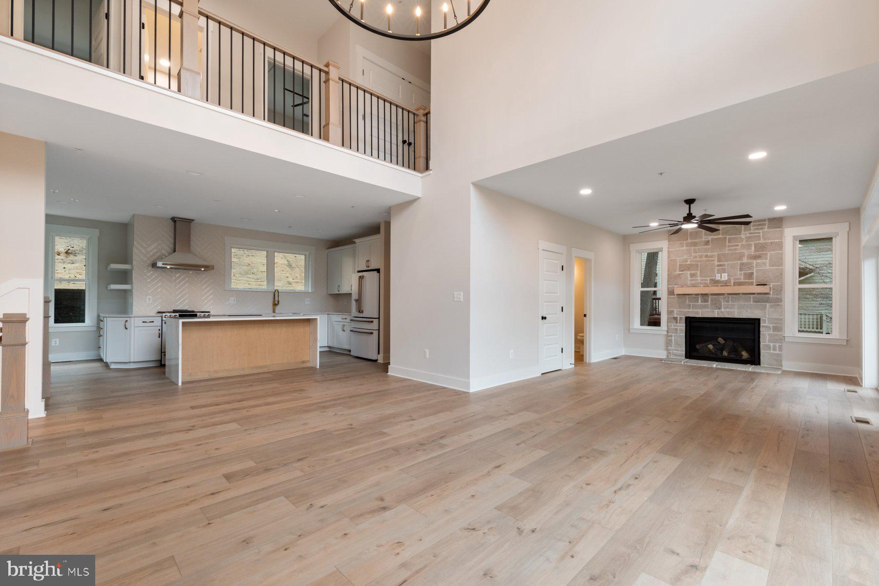 6719 West Lakeridge Road New Market, MD 21774 - Photo 15 of 49 a view of kitchen and kitchen with furniture wooden floor and window