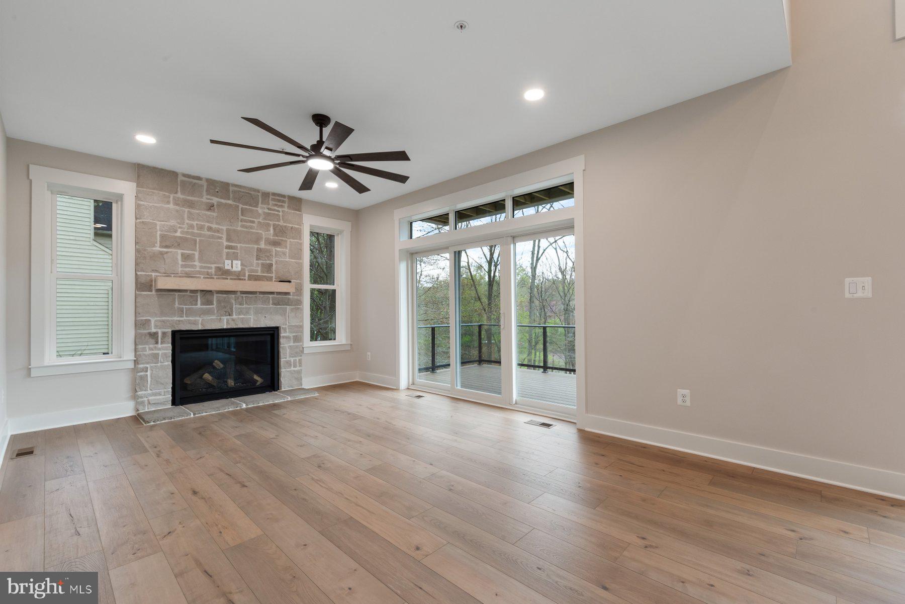 6719 West Lakeridge Road New Market, MD 21774 - Photo 16 of 49 a view of an empty room with a fireplace and a window