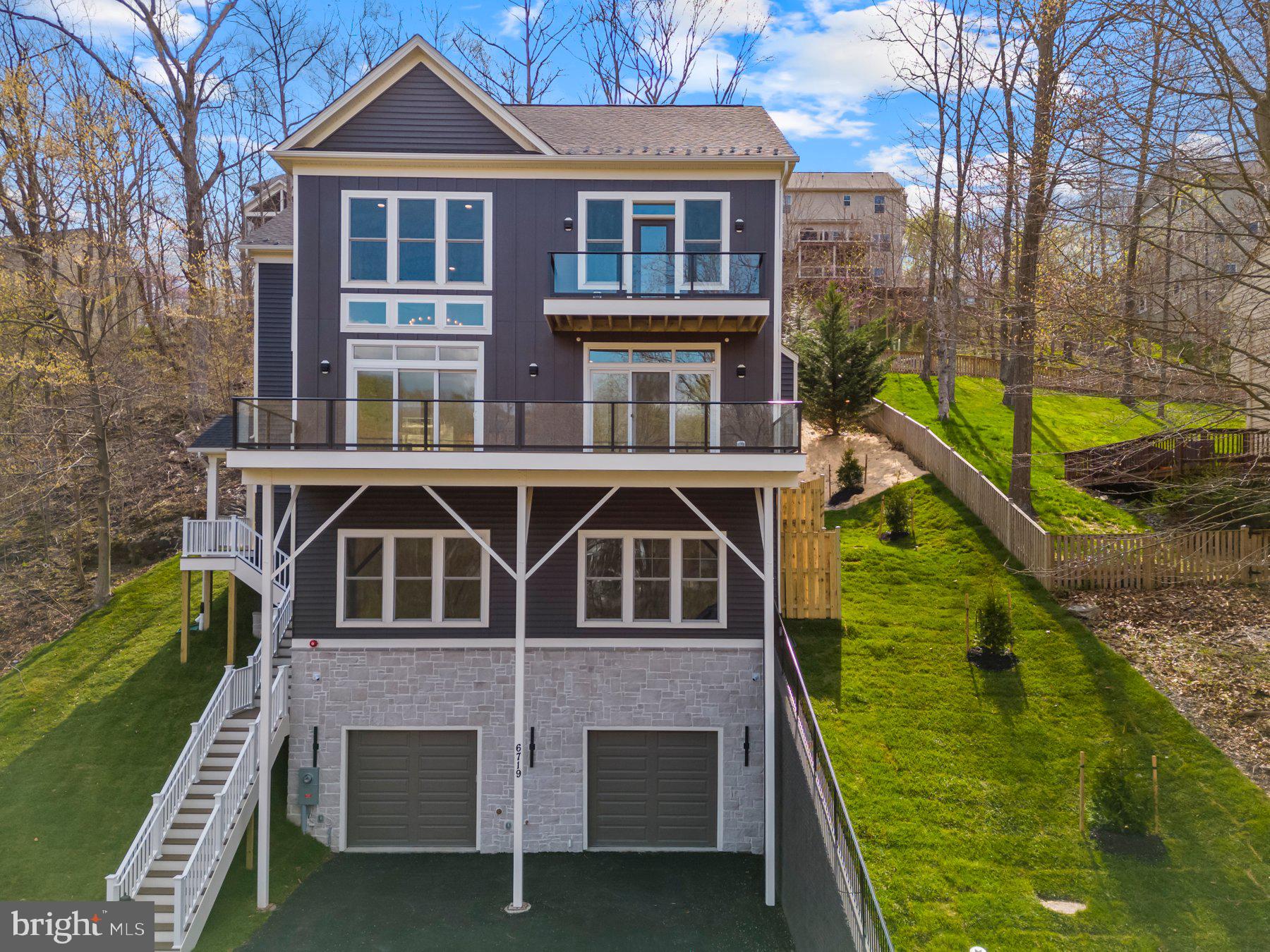 6719 West Lakeridge Road New Market, MD 21774 - Photo 2 of 49 a front view of a house with a yard