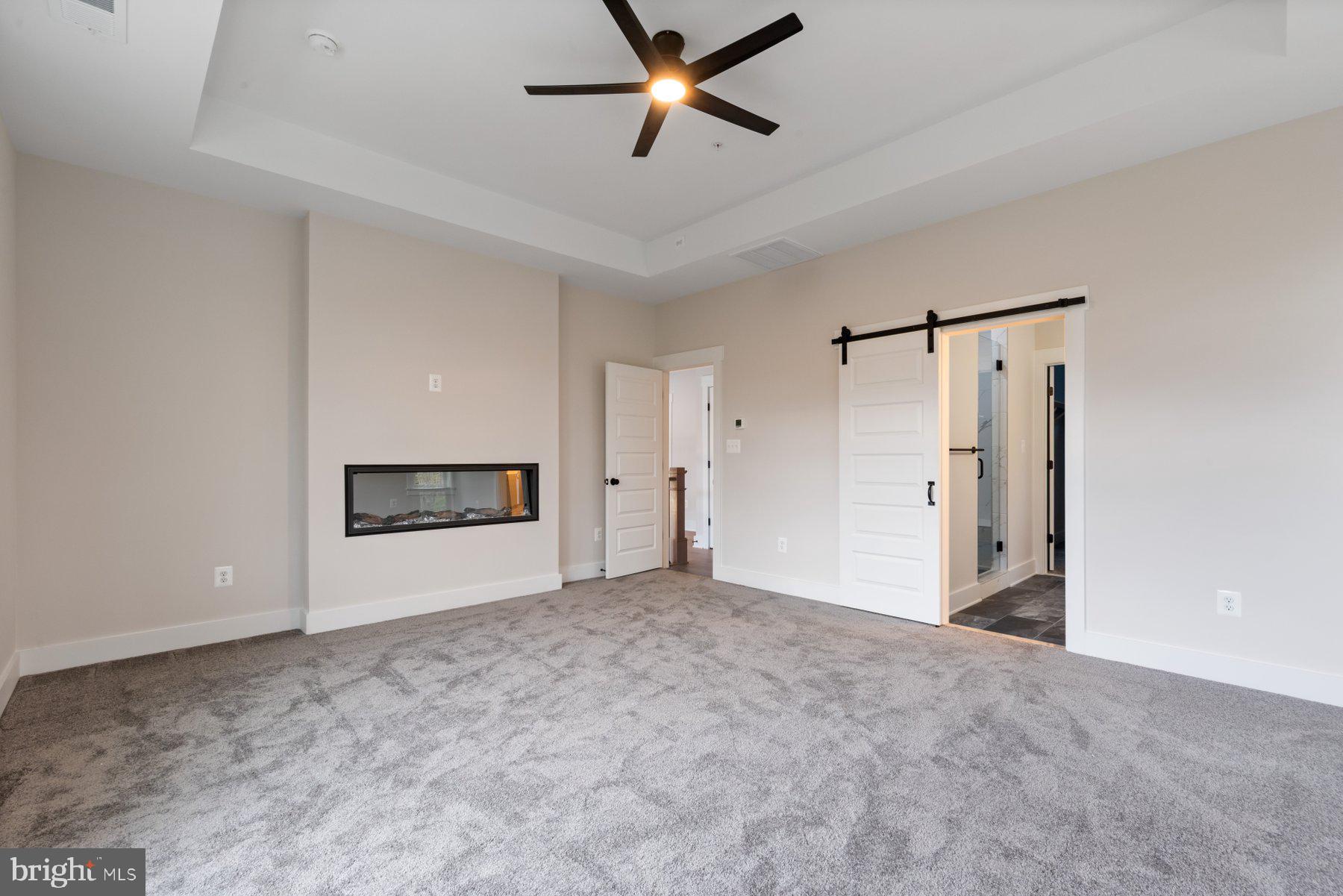 6719 West Lakeridge Road New Market, MD 21774 - Photo 21 of 49 a view of an empty room and a ceiling fan