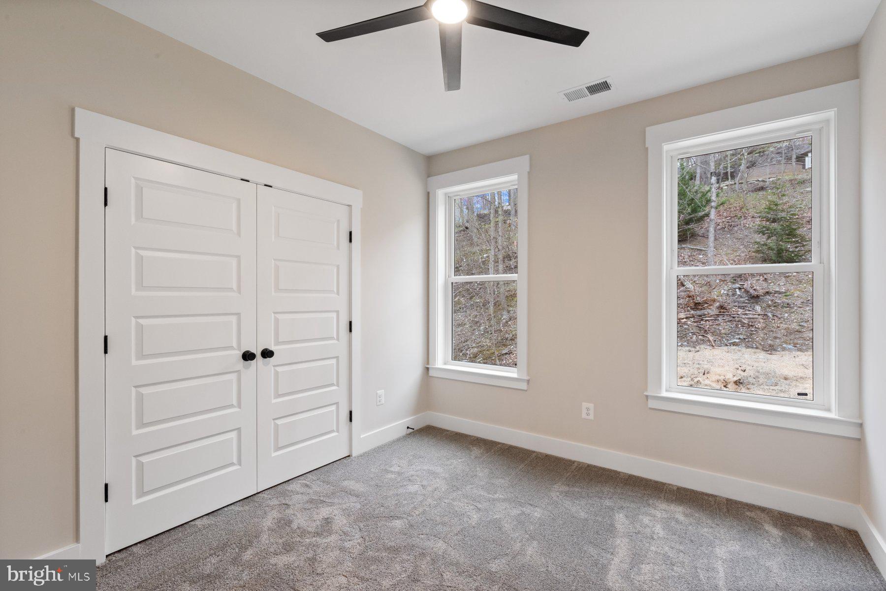 6719 West Lakeridge Road New Market, MD 21774 - Photo 24 of 49 a view of an empty room with a window