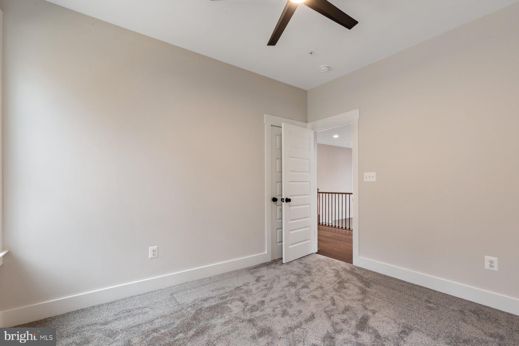 6719 West Lakeridge Road New Market, MD 21774 - Photo 25 of 49 an empty room with closet and fan