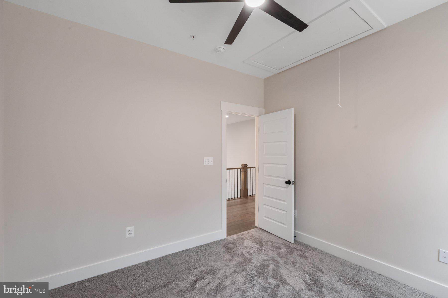 6719 West Lakeridge Road New Market, MD 21774 - Photo 28 of 49 an empty room with closet and a ceiling fan