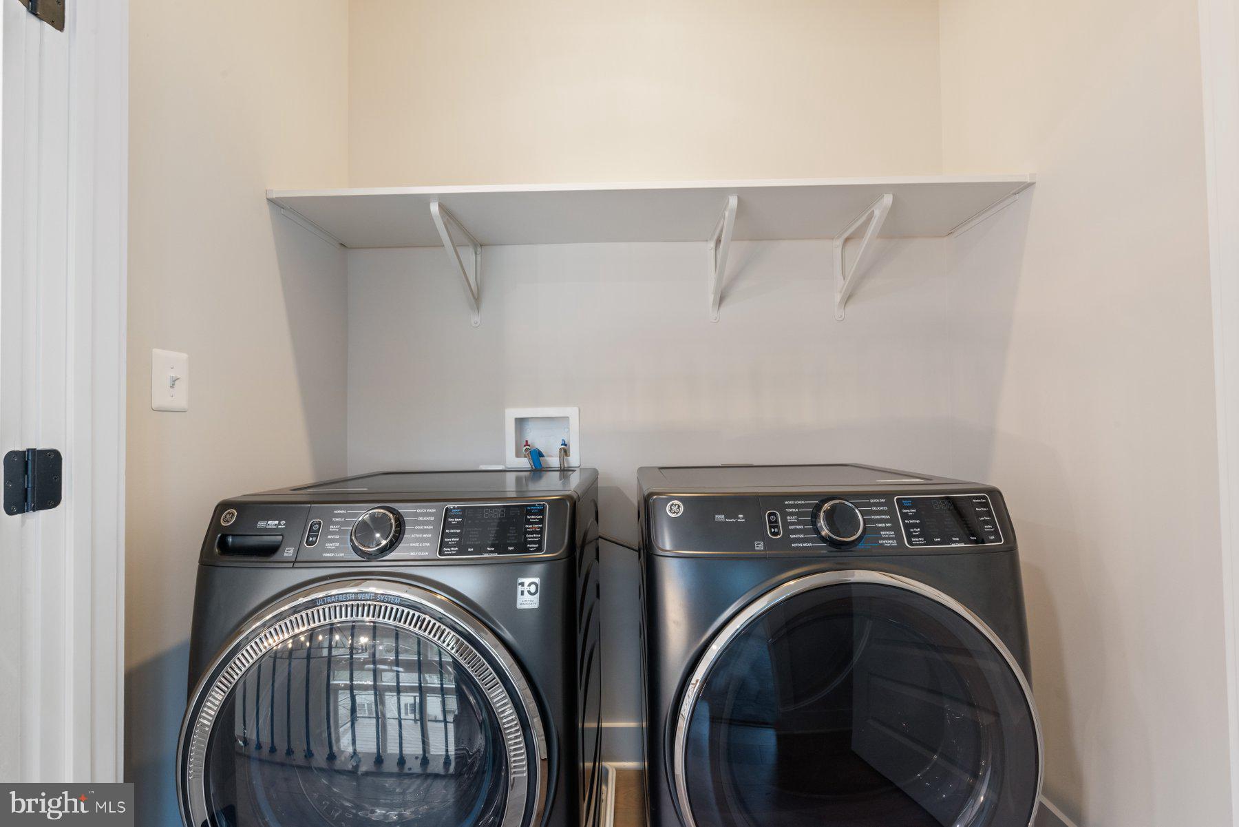 6719 West Lakeridge Road New Market, MD 21774 - Photo 29 of 49 a utility room with dryer and washer