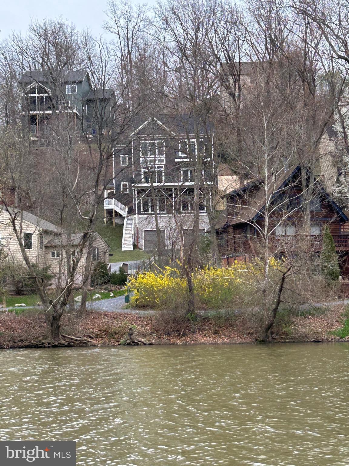 6719 West Lakeridge Road New Market, MD 21774 - Photo 4 of 49 a view of a lake with a house
