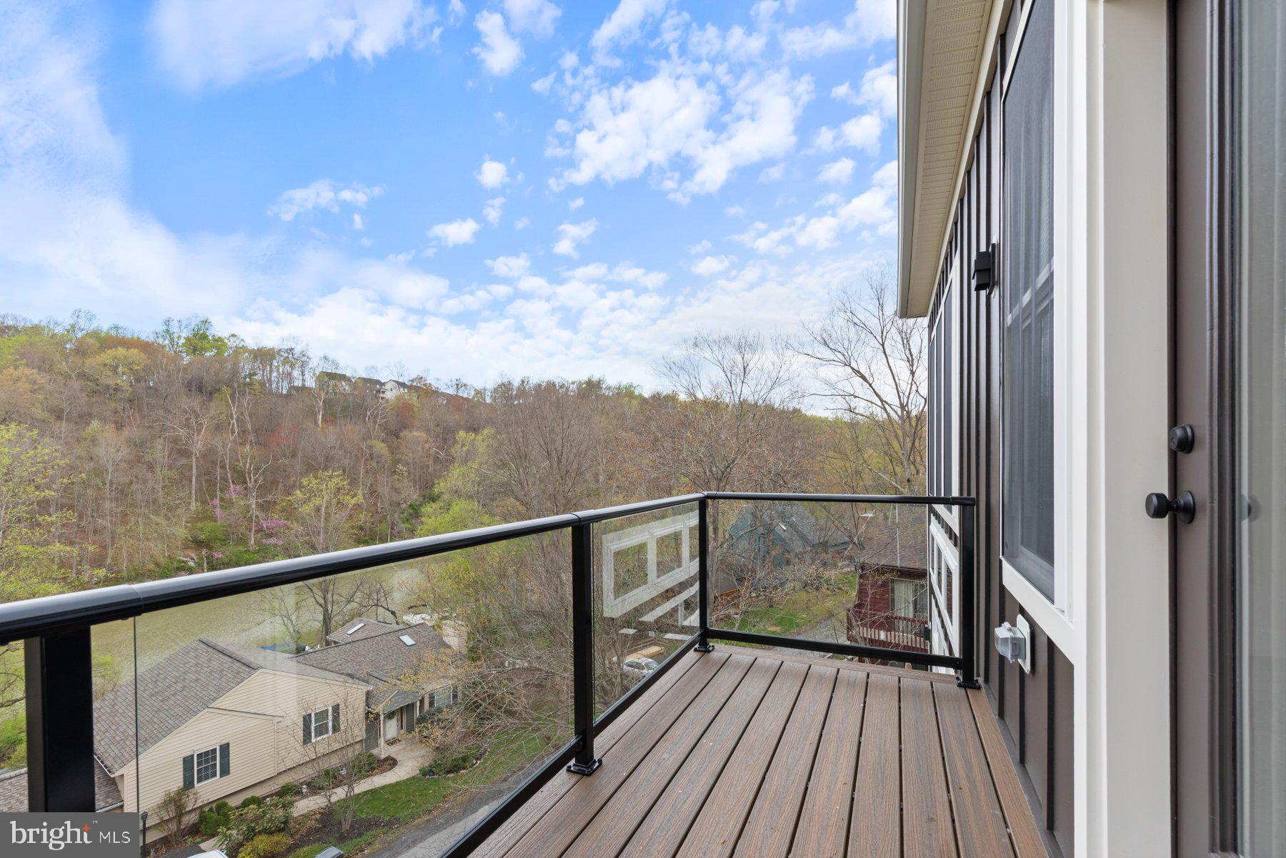 6719 West Lakeridge Road New Market, MD 21774 - Photo 5 of 49 a view of a balcony with wooden floor and fence