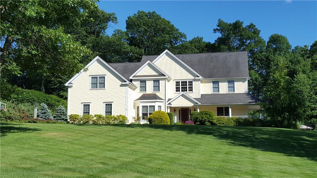 7 Boulder Creek Road Newtown, CT 06470 - Photo 1 of 1 a view of a white house with a yard and sitting area