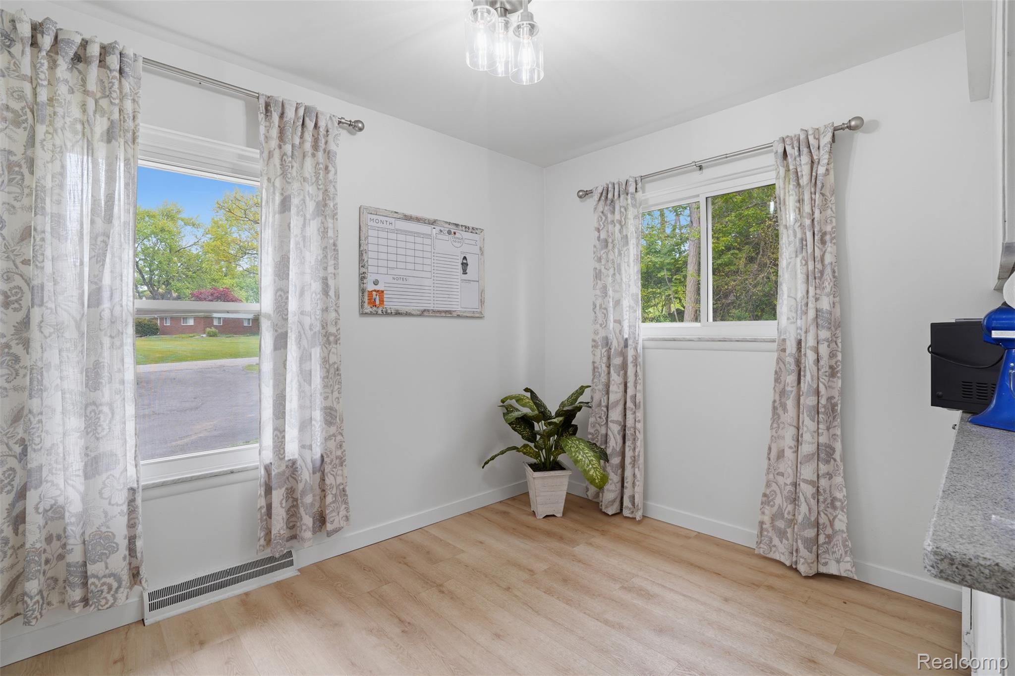47129 Dunsany Road Northville, MI 48167 - Photo 16 of 49 Empty room with light wood-style floors and baseboards