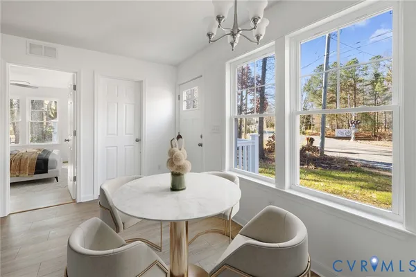 a view of a dining room with furniture window and outside view