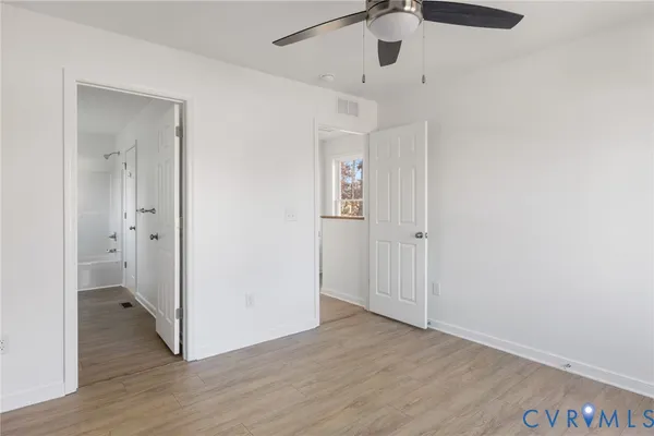 a view of an entryway with wooden floor