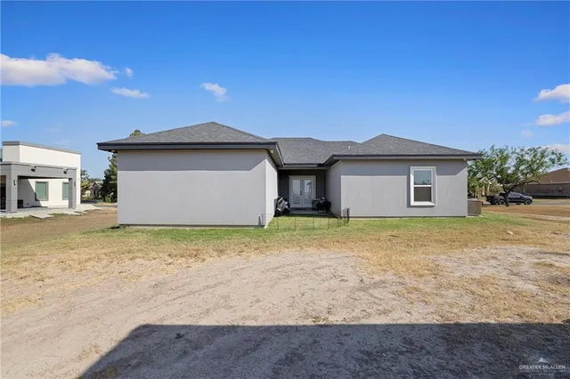 a house with trees in front of it