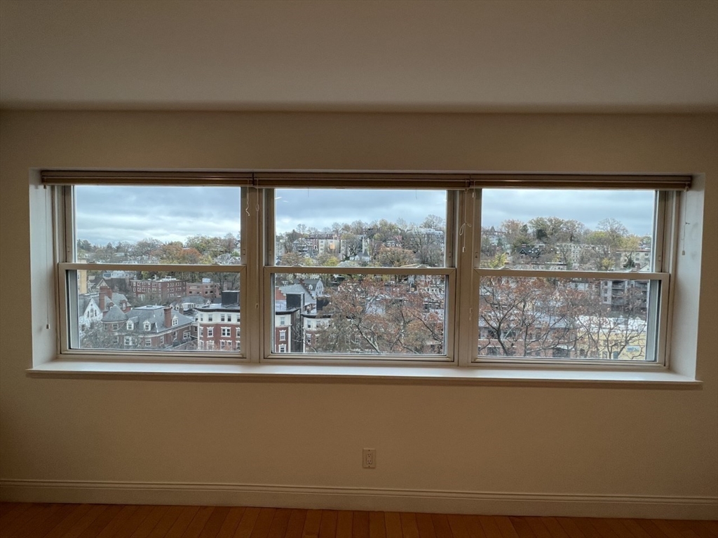 1600 Beacon Street, Unit 1002 Brookline, MA 02446 - Photo 13 of 16 a view of empty room with large windows