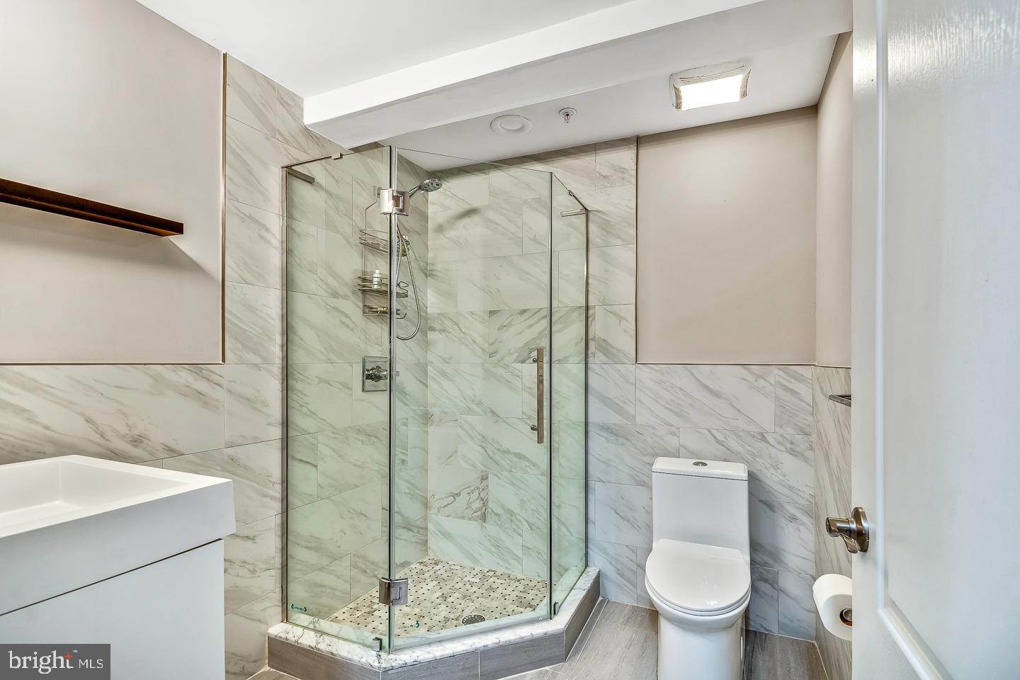 1945 Watkins Street Philadelphia, PA 19145 - Photo 18 of 31 a bathroom with a shower and a toilet
