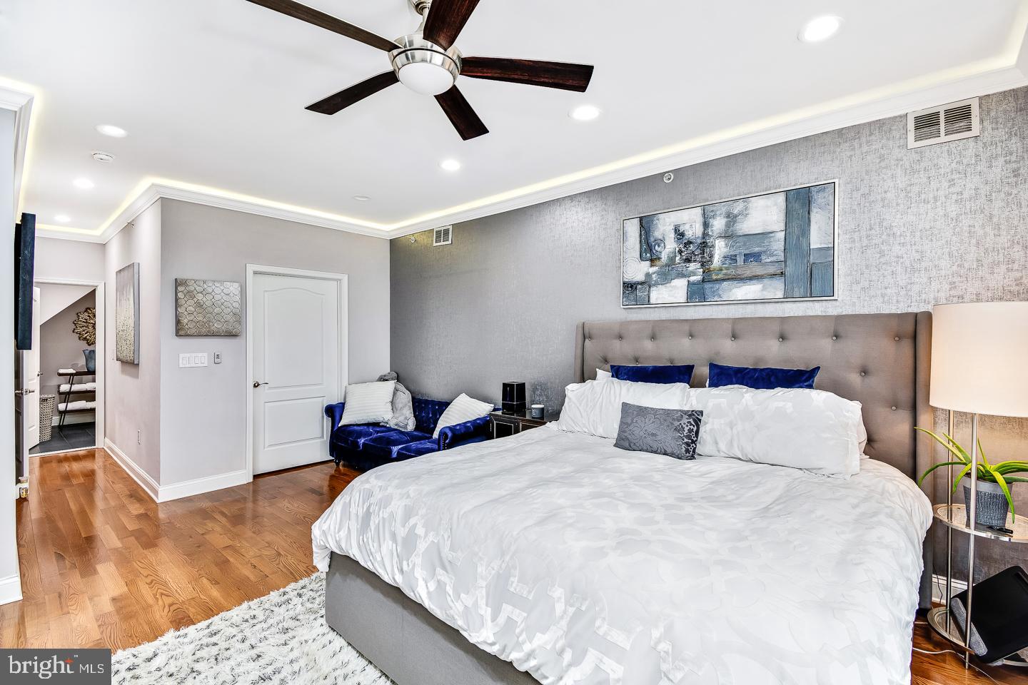 1945 Watkins Street Philadelphia, PA 19145 - Photo 25 of 31 a bedroom with a large bed and a chandelier