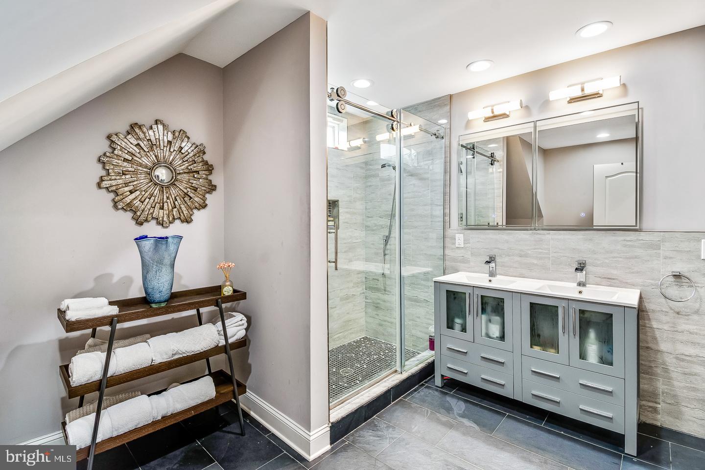 1945 Watkins Street Philadelphia, PA 19145 - Photo 27 of 31 a bathroom with a double vanity sink mirror and shower